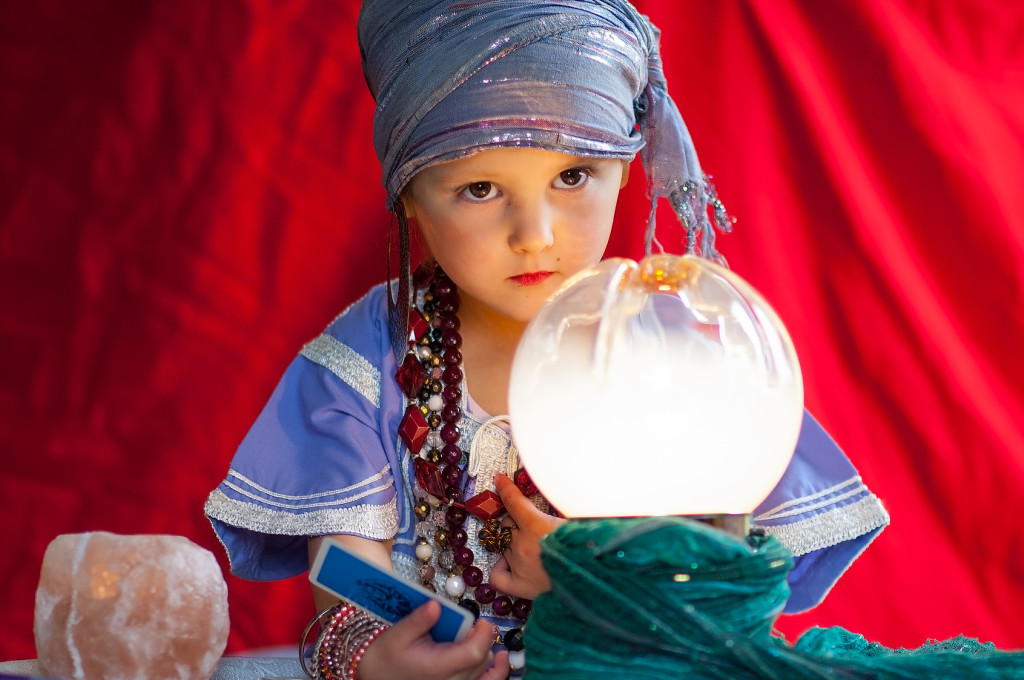 little child plays to be a fortune teller